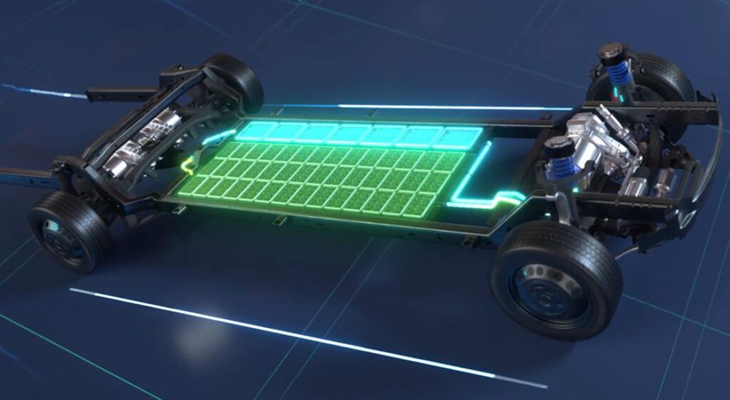 A green light is shown on the back of an electric skateboard.